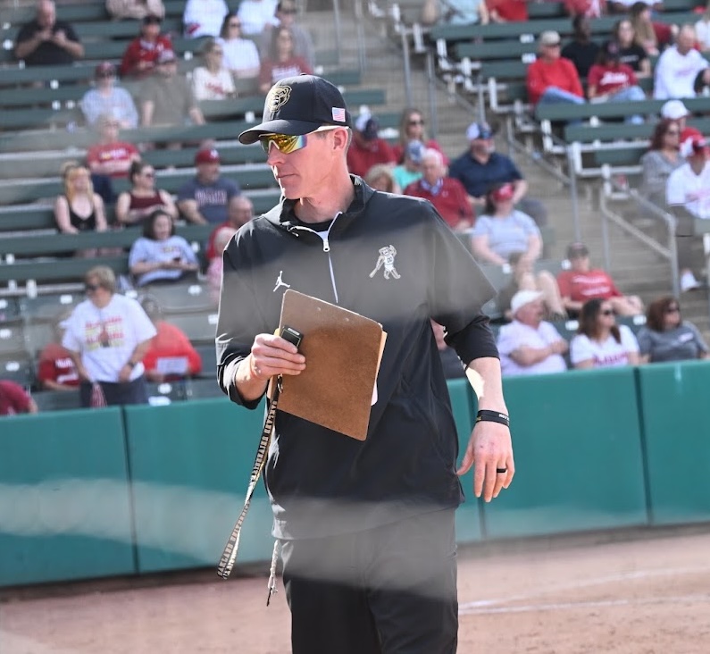 Coach Chris Stelma reviewing the camp schedule for the day.